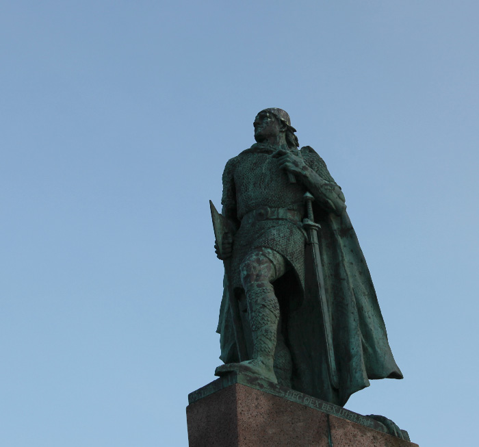 the Old Evangelization — Leifr Eiríksson sculpture by A.S. Calder with Cross and in chainmail with sword and battleaxe, Reykjavík