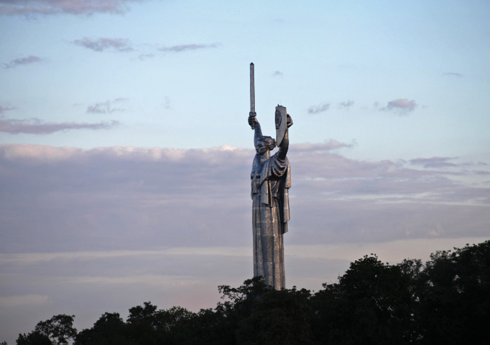 Motherland Monumnet towering over the trees of Kyiv